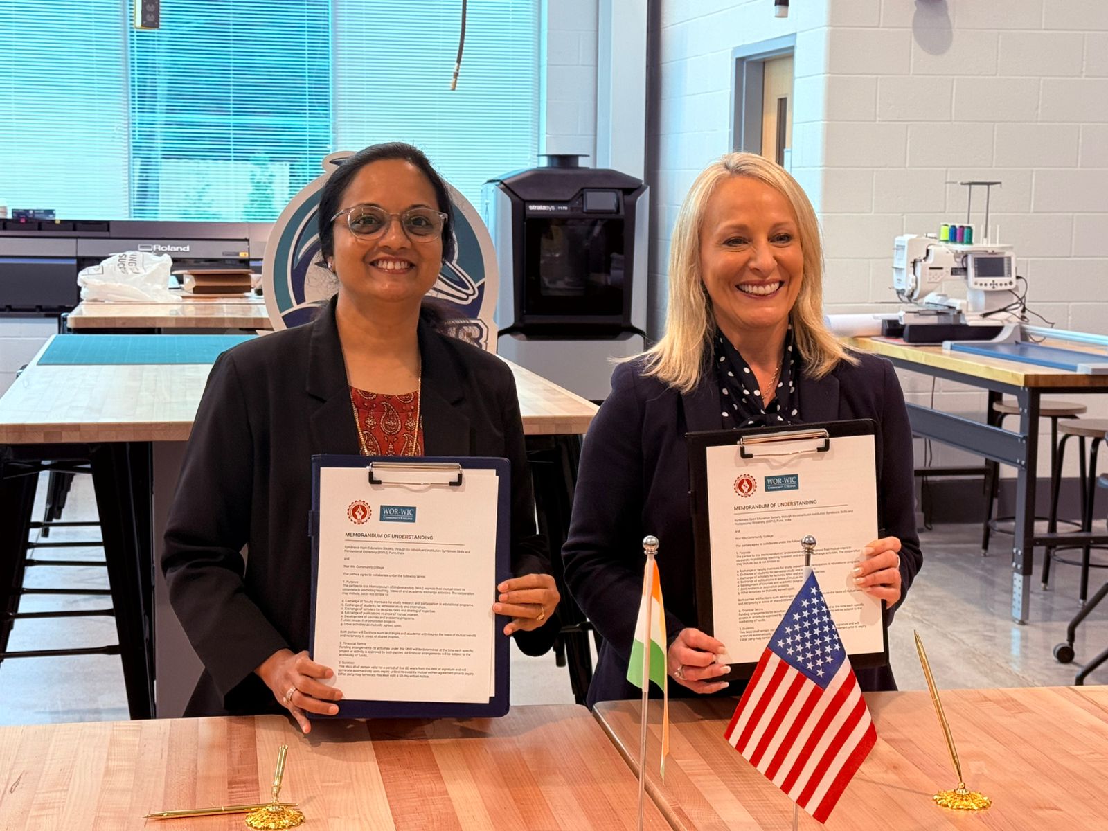 Wor-Wic Community College and Symbiosis Skills and Professional University officials signing the MOU.